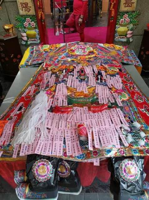 "Photo of a large paper robe with names of all devotees participating in the “presentation of the robes” ritual. Photo taken on Feb 24, 2020, posted by Siang Cho Keong on the temple’s Facebook page (Siang Cho Keong 仙祖宫 2020a)."